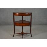 A George III mahogany corner washstand, of bow front, with a fold over top, over a single drawer, on