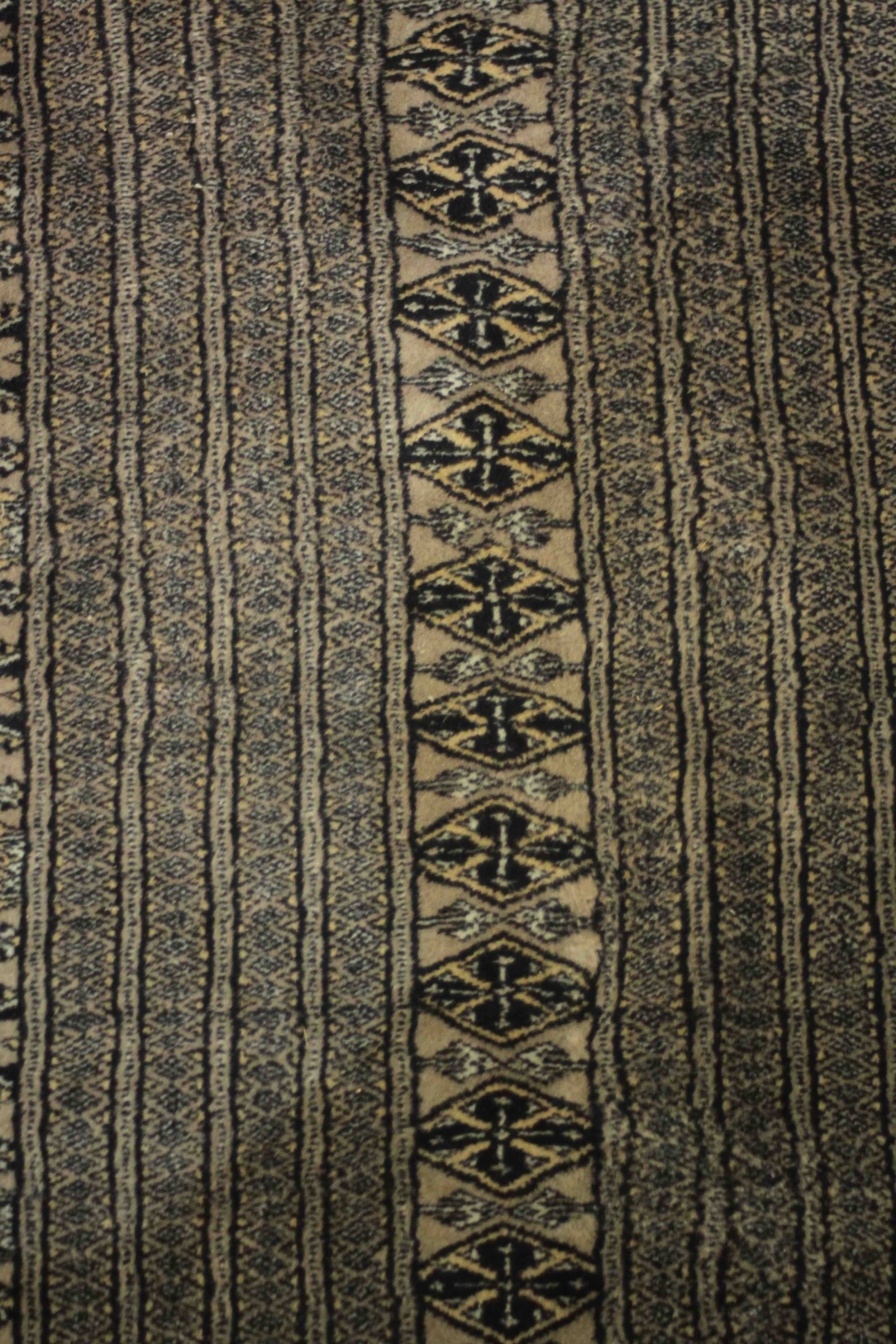 A hand made blue ground Bokhara carpet. L.460 W.310cm. - Image 6 of 7