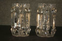 A pair of Georgian clear glass table lustres with crystal drops on star cut feet. H.30 Dia.11cm.