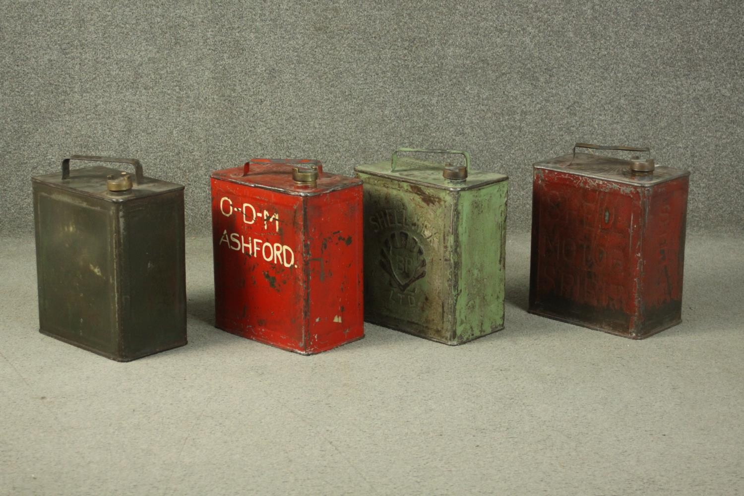 Four 20th century painted metal Jerry cans, marked for O-D-M Ashford, Insect Repellent, BP Ltd Shell