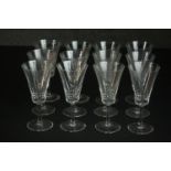A set of twelve hand cut crystal wine glasses with trumpet shape. H.16 Dia.6cm.