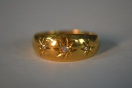 An 18ct yellow gold and old mine diamond gypsy ring, set with three cushion shaped old mine diamonds