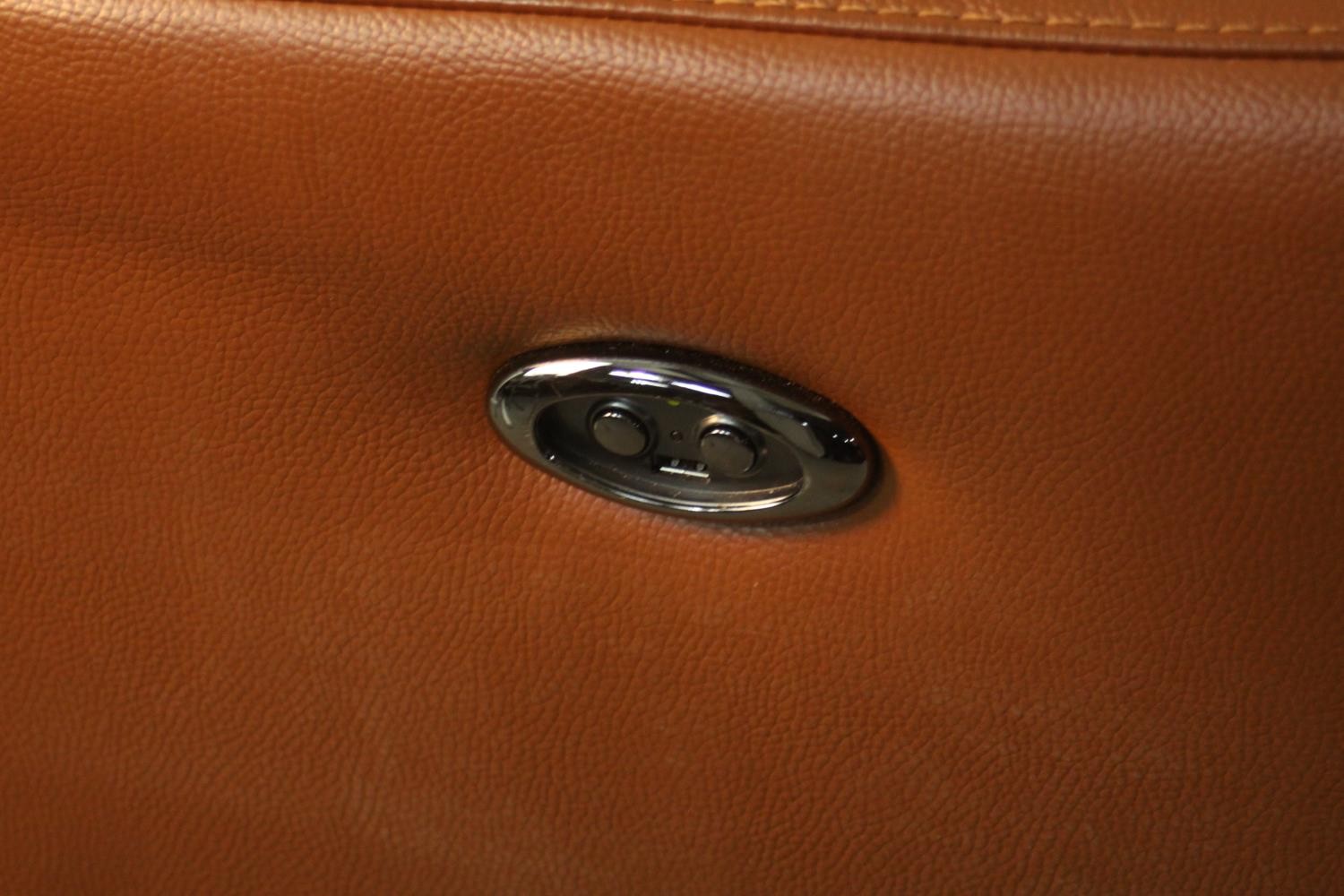 A contemporary tan leather electric reclining armchair, possibly Natuzzi, with instructions. In good - Image 5 of 10