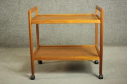 A circa 1970s Danish teak tea trolley, with two tiers, stamped 'Made in Denmark' to the underside.