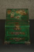 A contemporary Chinese travel dressing chest, green with painted gilt details, the lid opening to