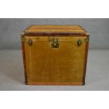 A late 19th/early 20th century steamer trunk, similar to those made by Louis Vuitton, with a printed