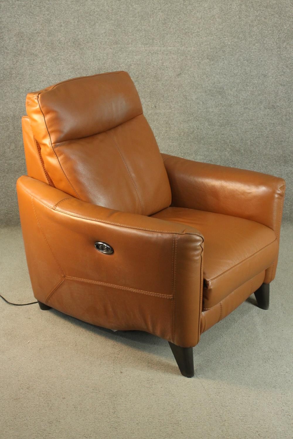 A contemporary tan leather electric reclining armchair, possibly Natuzzi, with instructions. In good - Image 2 of 10