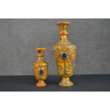 Two Buddhist gemstone set and brass studded beeswax vases. H.47cm (largest)
