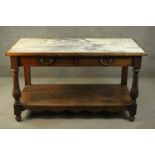 A 19th century French chestnut wash stand, the rectangular top set with white marble, over two short