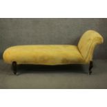A Victorian mahogany chaise longue, upholstered in yellow fabric, on cabriole legs. H.80 W.100 D.