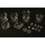 A collection of glassware, including knife rests, etched pudding glasses and salts. H.17 Dia.