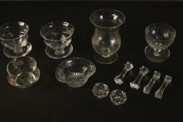 A collection of glassware, including knife rests, etched pudding glasses and salts. H.17 Dia.