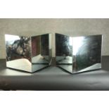 A pair of contemporary mirrored cubes (damaged as seen). H.40 W.40 D.40cm.