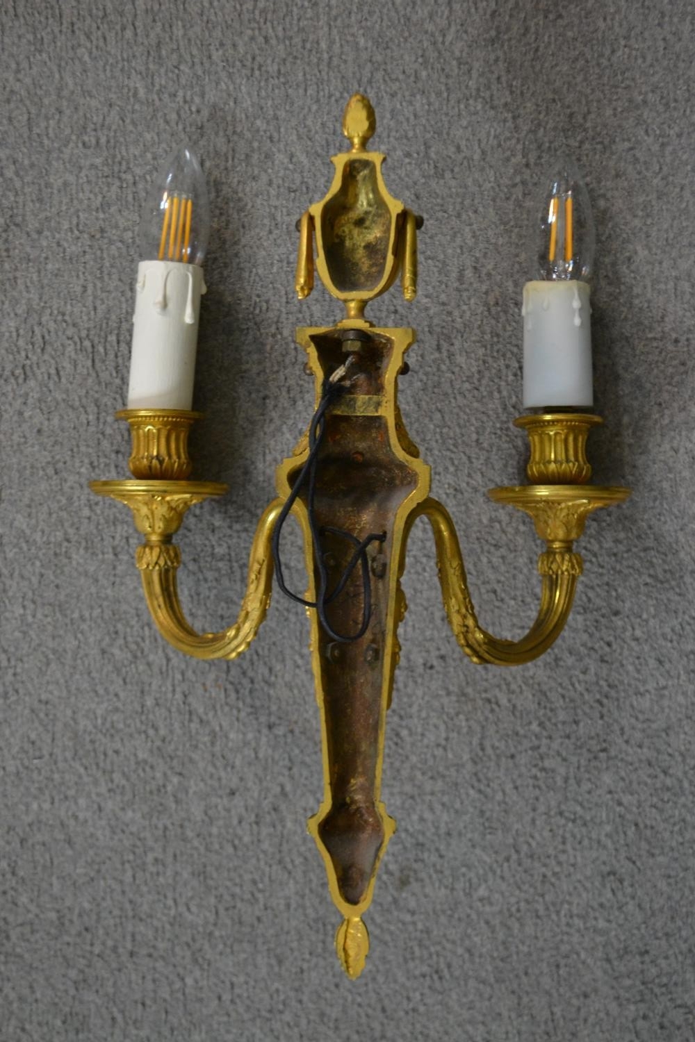 A pair of 19th century gilt metal two branch wall sconces with swag and foliate design. H.39 W.49cm - Image 6 of 6