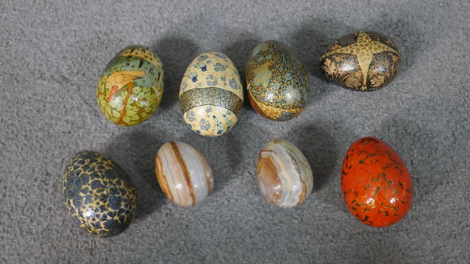 An Indian brass pedestal bowl filled with eight hand painted papier mache eggs. - Image 5 of 5
