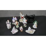 A collection of collection of nine hand painted porcelain figures and a 19th century black and
