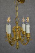 A 19th century gilt metal four branch foliate design chandelier. H.36 W.24cm