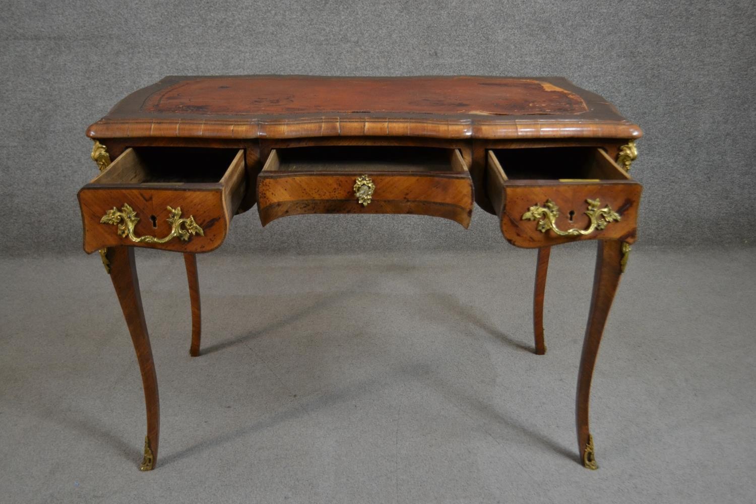 A Louis XV style bureau plat, with a tooled brown leather writing surface, over three short drawers, - Image 2 of 10