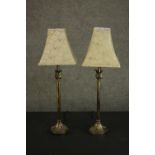 A pair of 20th century brass table lamps, of cylindrical form, with acanthus leaf detail, on