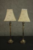 A pair of 20th century brass table lamps, of cylindrical form, with acanthus leaf detail, on