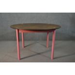 FDB Møbler, A Bjørk dining table, with a circular stained MDF top, on a pink painted base with