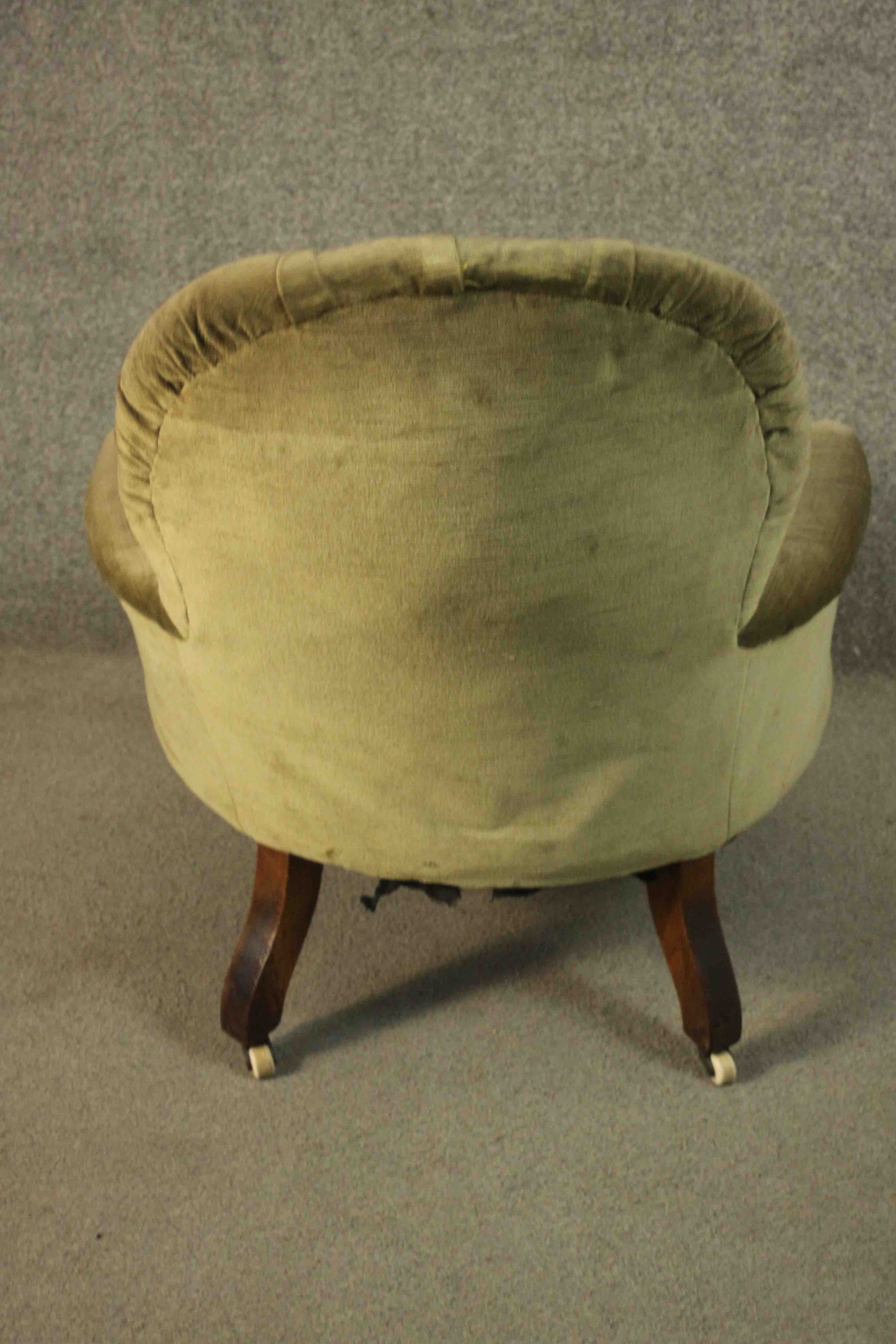 A Victorian armchair, upholstered in green velour with a buttoned back and arms, on turned walnut - Image 7 of 7