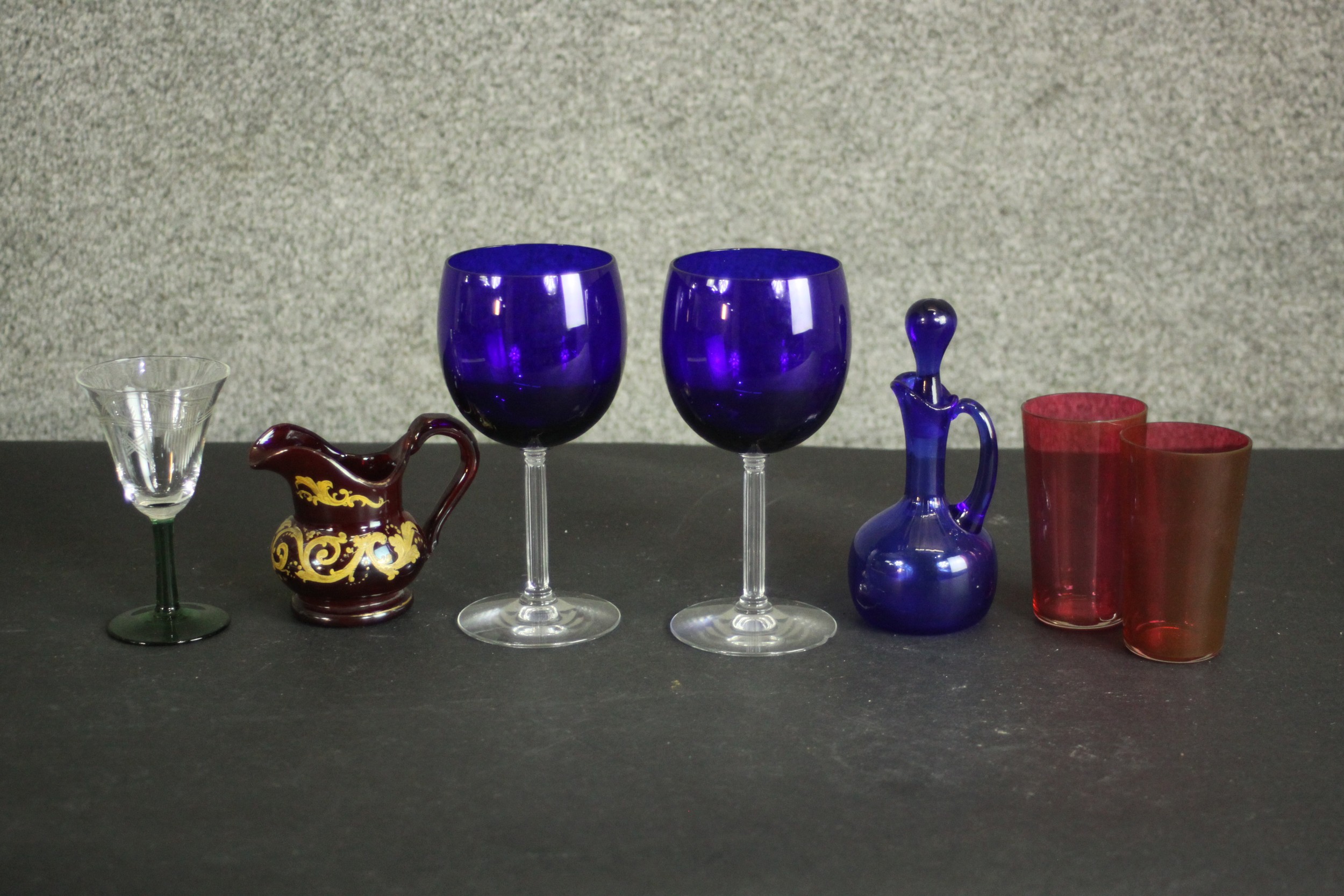 A collection of 19th century coloured glass, including a pair of Bristol blue blown glass wine