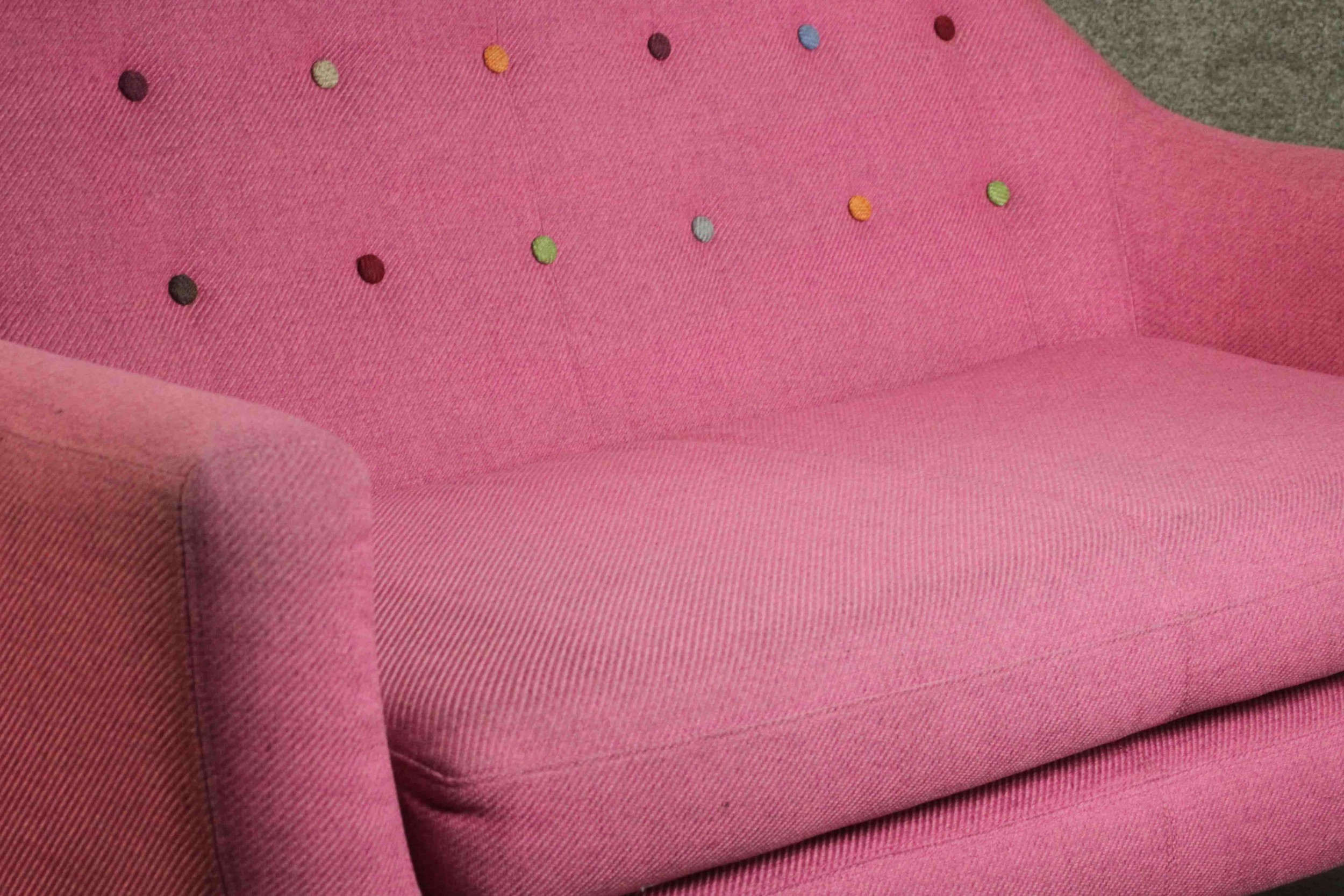 A contemporary Made.com Ritchie sofa, upholstered in pink with a polychrome buttoned back on - Image 8 of 8