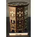 A 20th century Syrian style octagonal inlaid occasional table, with floral designs. H.48 Dia.38cm.