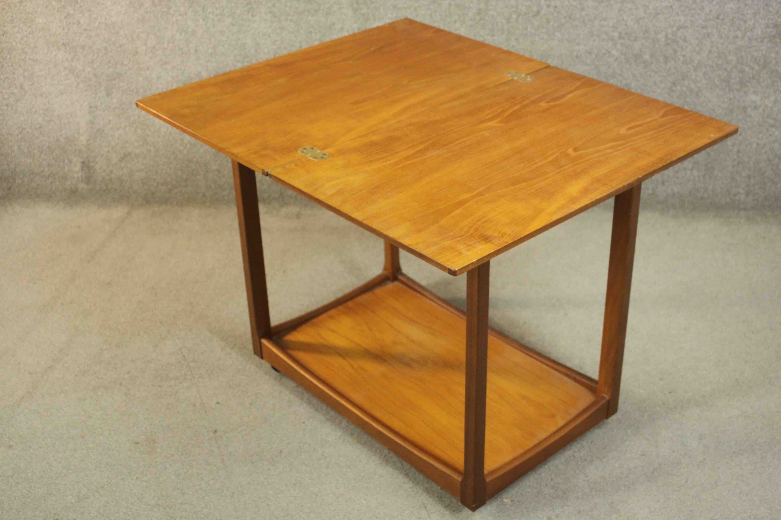 A circa 1960s teak trolley by Legate of Scotland of rectangular form with an undertier. H.68 W.71 - Image 12 of 16