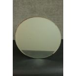 A circa 1940's circular mirror with a plywood back. Dia.47cm.