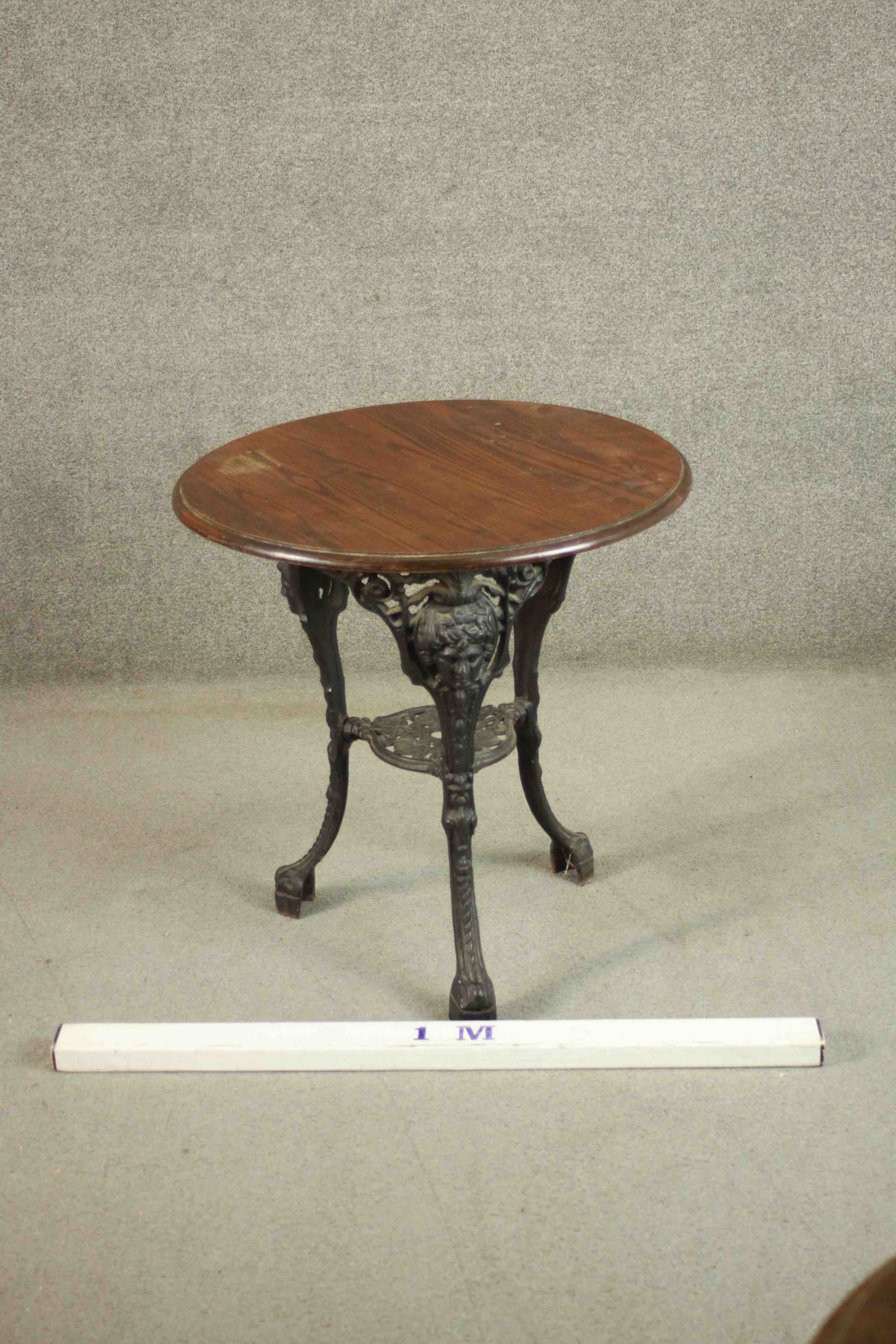 A black painted Victorian cast iron pub table with a circular pitch pine top on three curved legs - Image 2 of 4