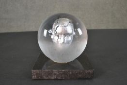 A BV Headman glass sculpture by Kosta Boda. A globe made of clear glass with a silver leaf head