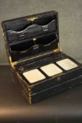 A Victorian black leather portable writing box by J.W. Allen. Gilded lettering for the names, a