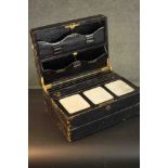A Victorian black leather portable writing box by J.W. Allen. Gilded lettering for the names, a