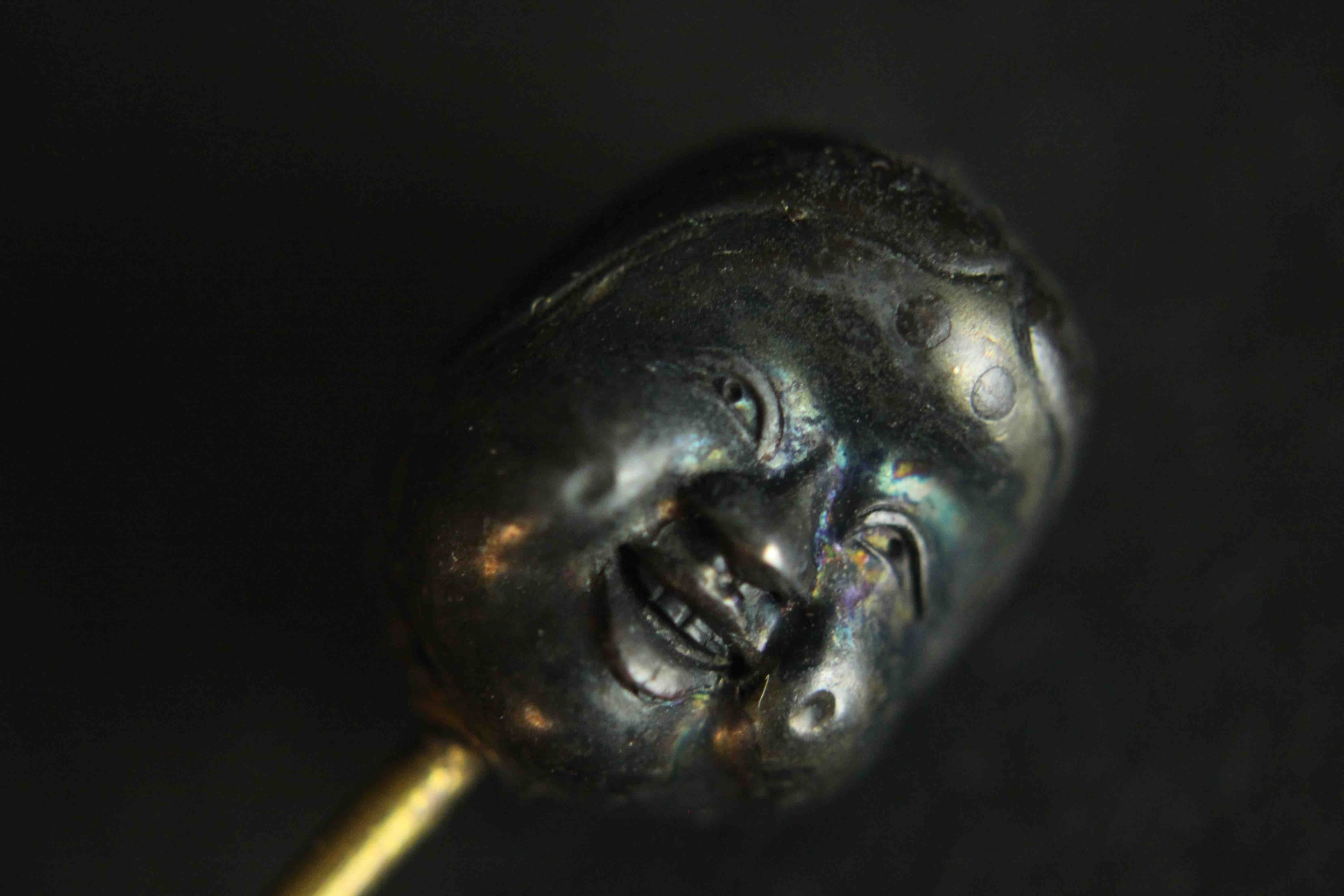 A Japanese Meji period Shakudo ware stick pin one side with a man's face and the other side with a - Image 6 of 9