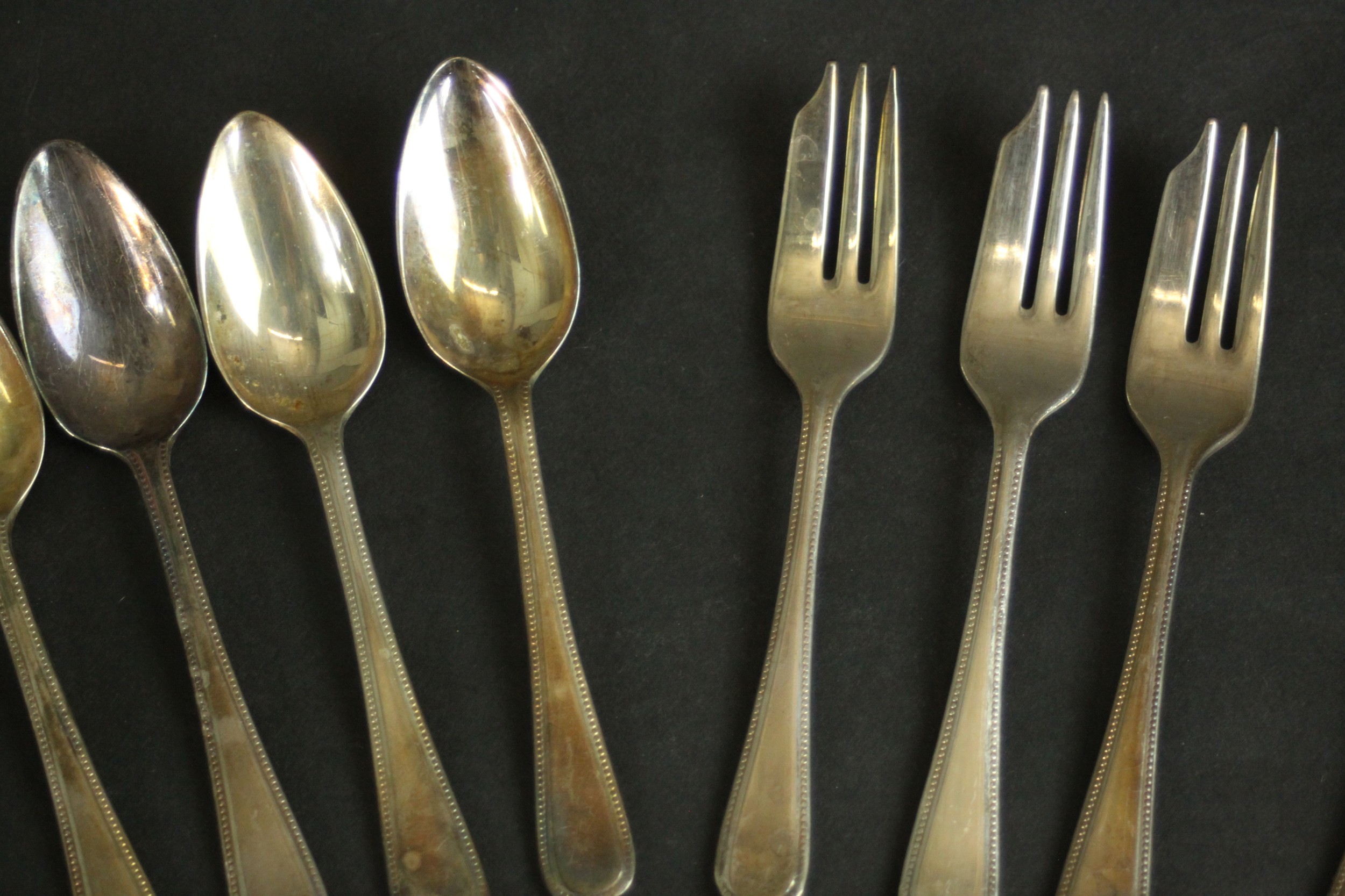 A collection of Harrods silver plated cutlery, including six grapefruit spoons, five fruit forks and - Image 4 of 9