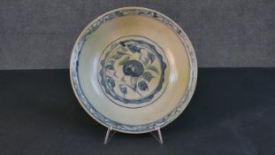 A 19th century Chinese porcelain hand painted celadon glaze bowl. Decorated with a stylised floral