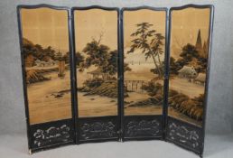 A Japanese 19th century carved and pierced ebonised four panel folding screen with painted