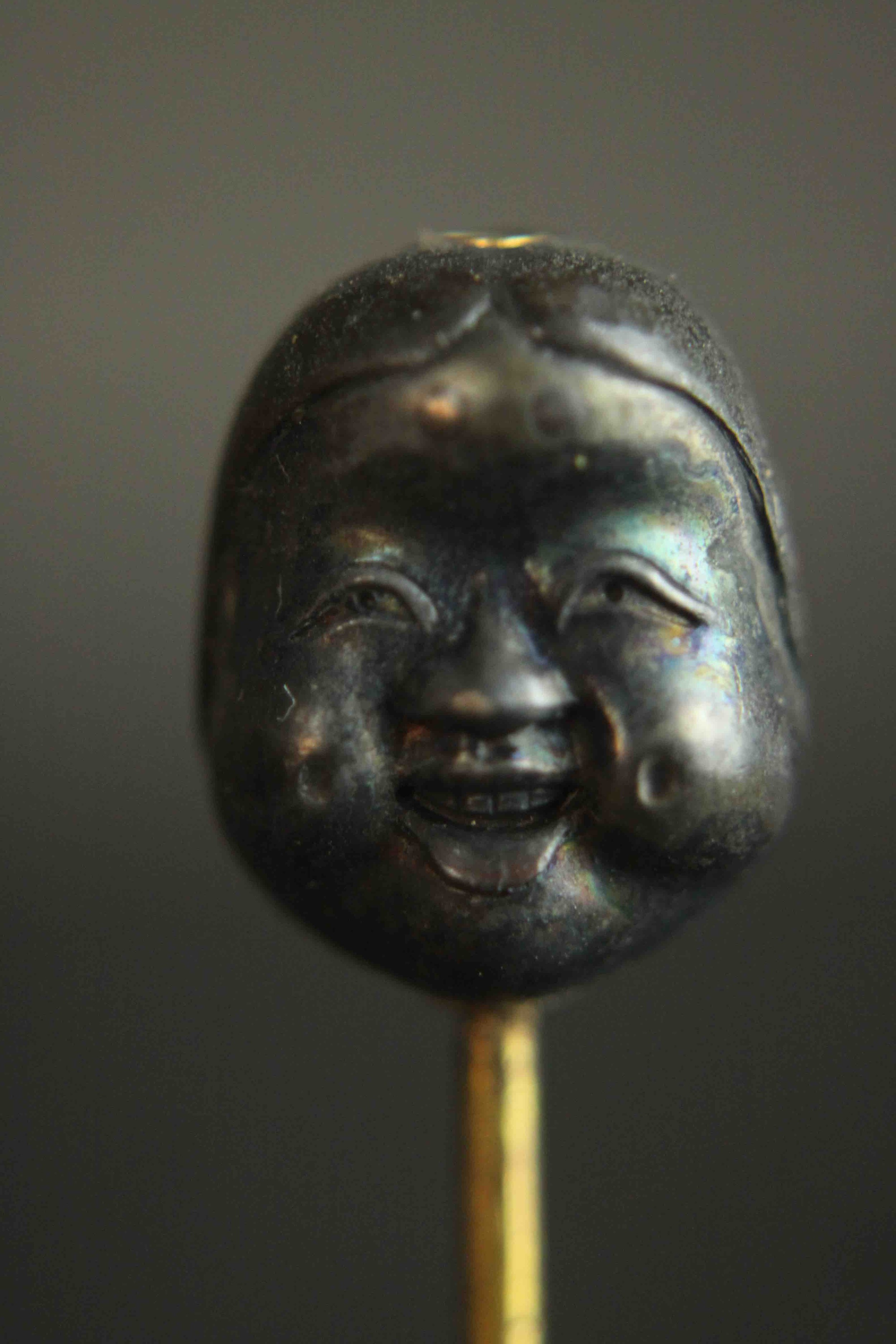 A Japanese Meji period Shakudo ware stick pin one side with a man's face and the other side with a - Image 7 of 9