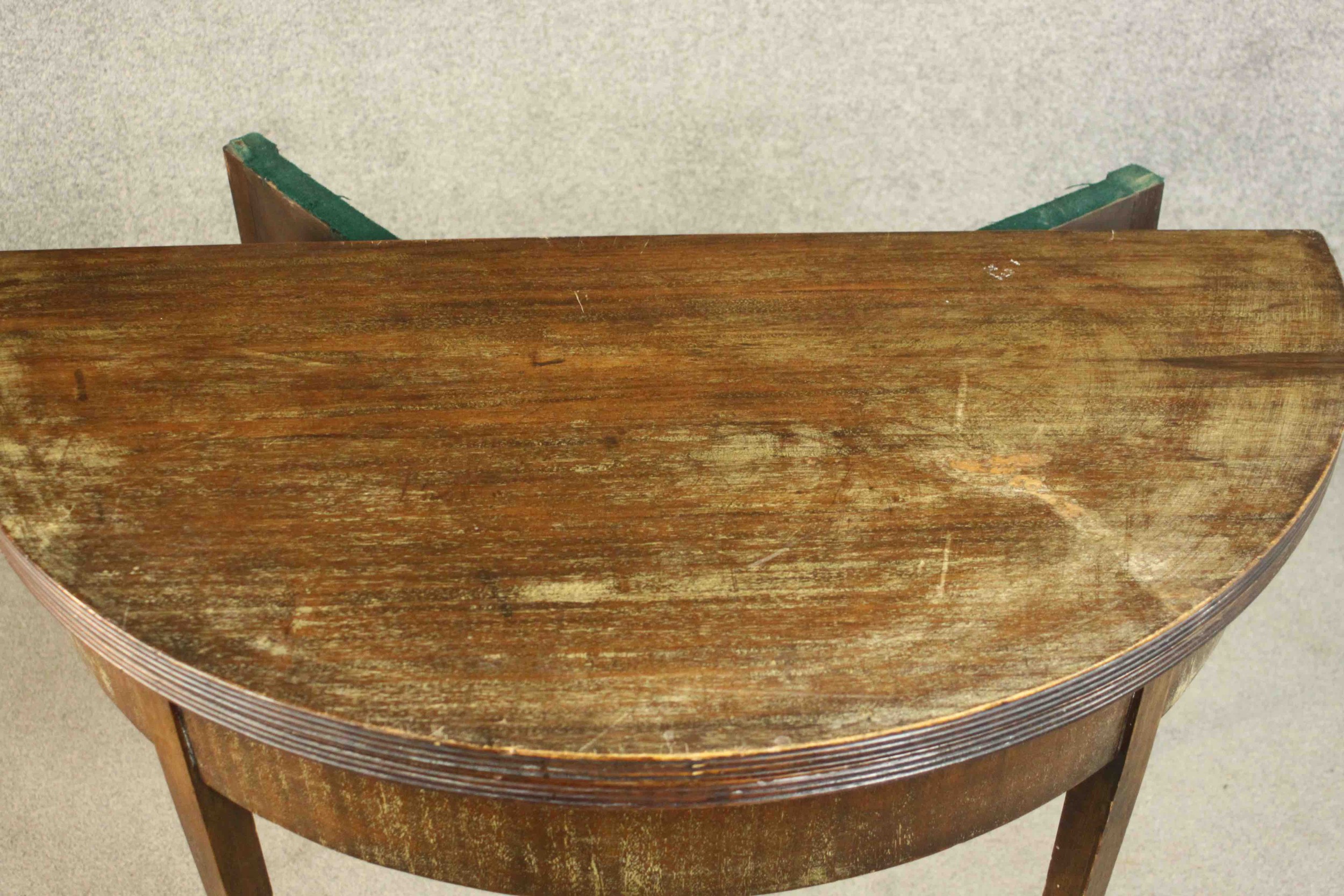 A George III mahogany demi-lune tea table, with a moulded edge and foldover top on square section - Image 9 of 10