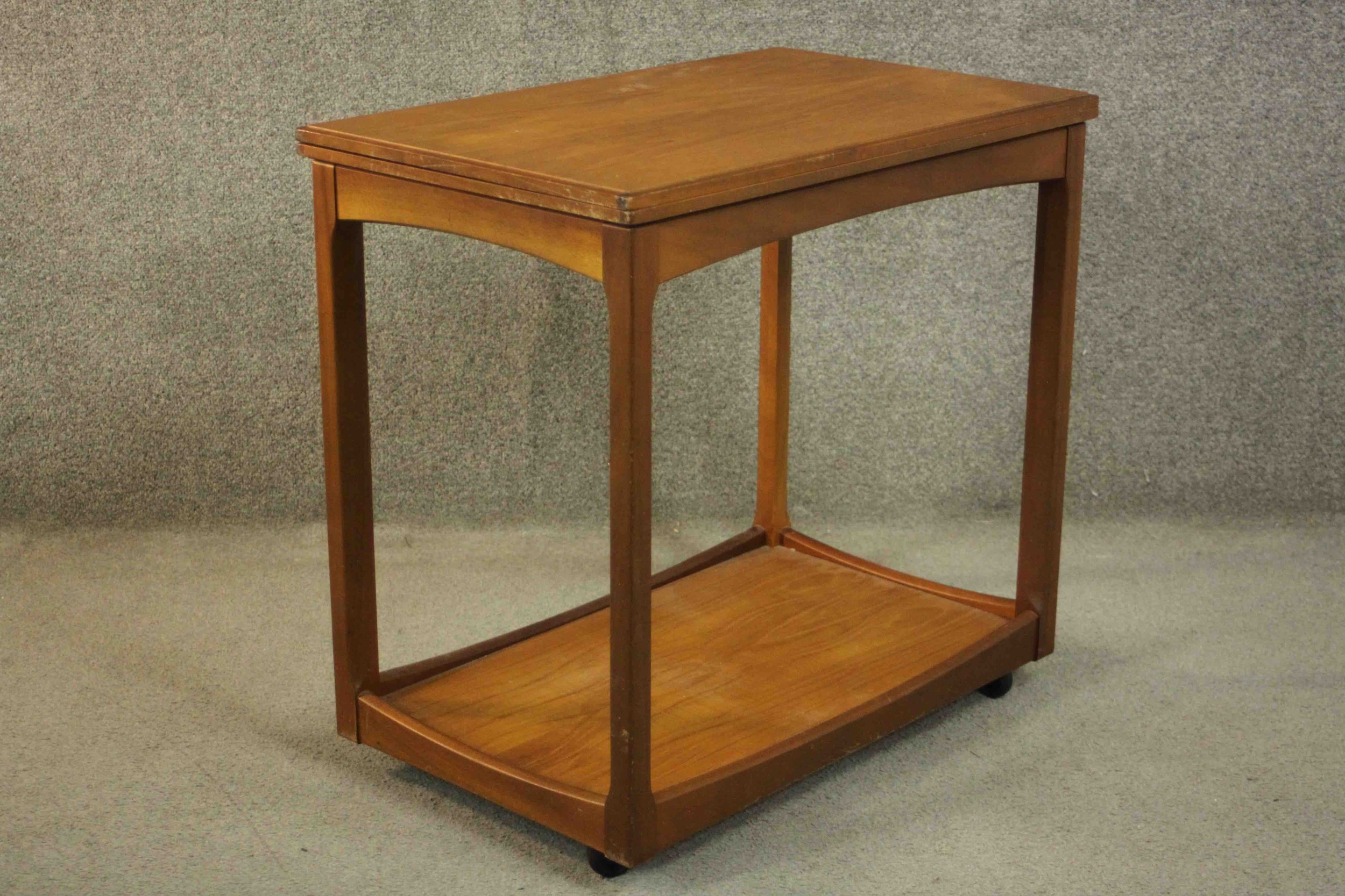 A circa 1960s teak trolley by Legate of Scotland of rectangular form with an undertier. H.68 W.71 - Image 6 of 16