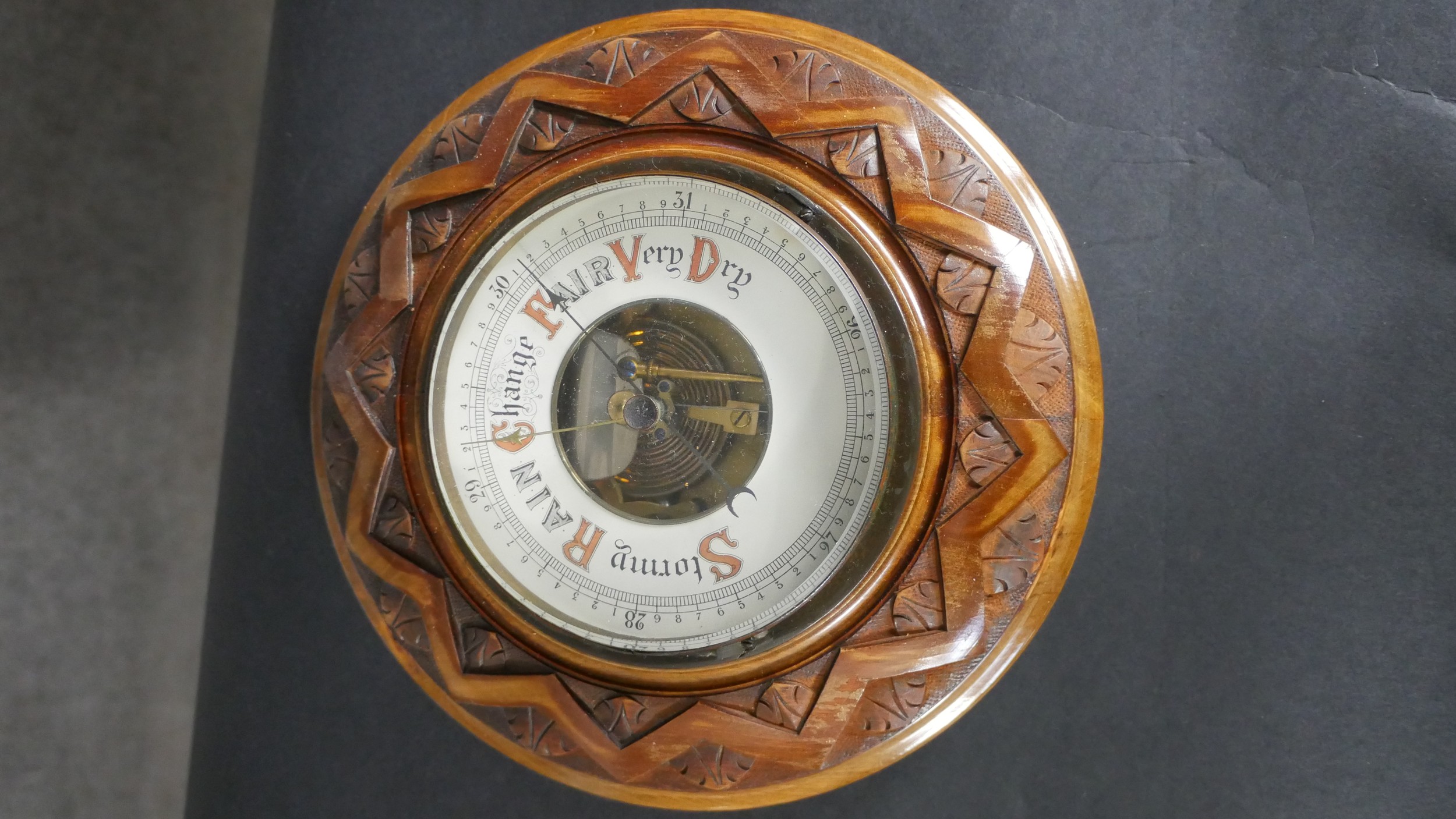 An early 20th century carved oak Barometer with enamel dial along with a marquetry shield - Image 6 of 6