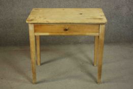 A Victorian pine writing table, of rectangular form with a single frieze drawer on square section