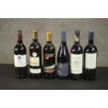 A collection of six bottles of red wine, various regions and vintages. H.30cm.