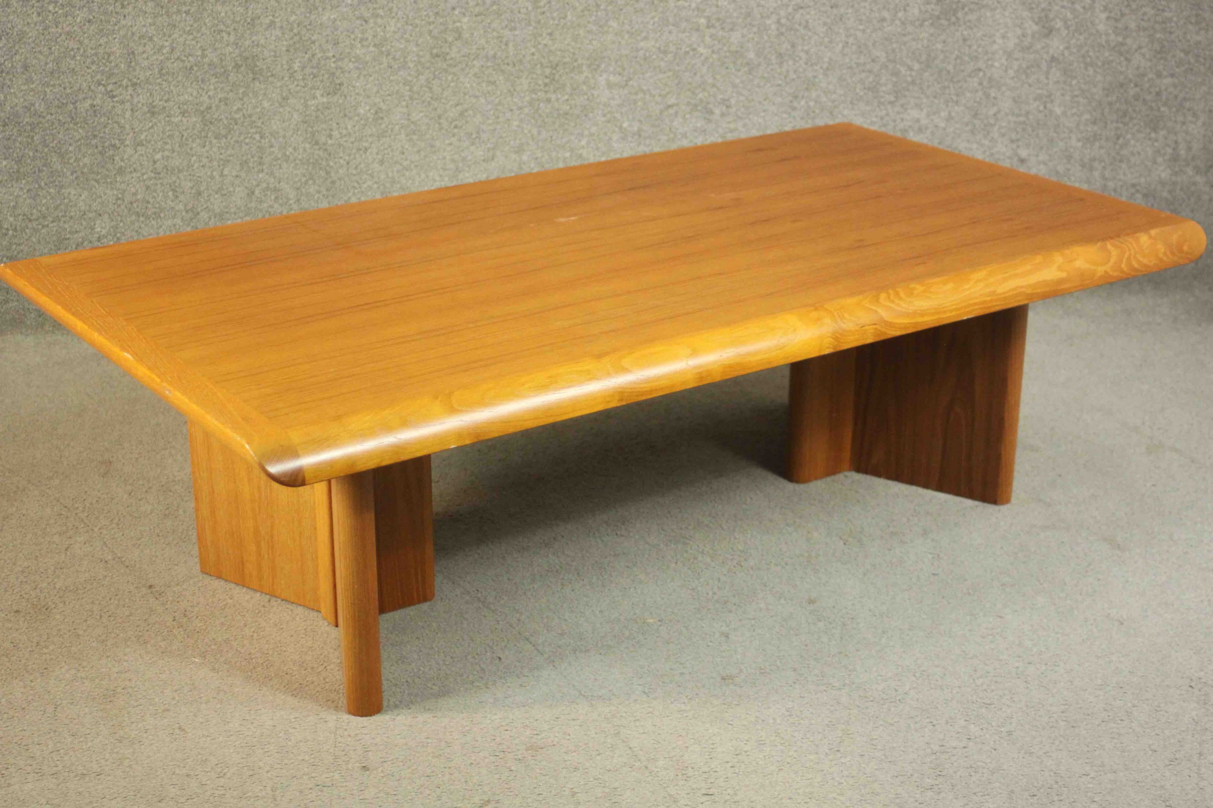 A 1970s vintage Danish teak coffee table on shaped block end supports. H.40 W.135 D.75cm. - Image 4 of 6