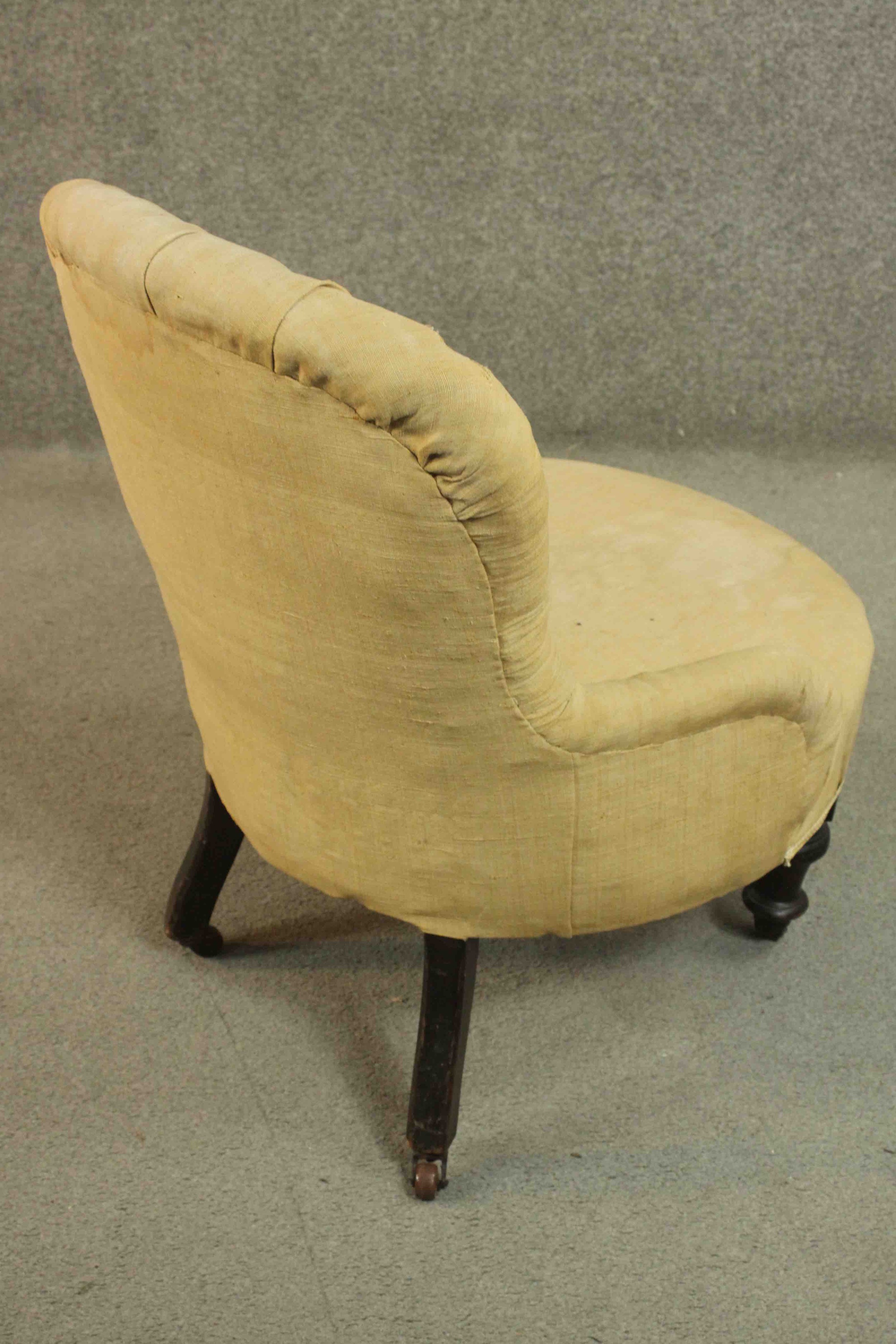 A Victorian nursing chair, upholstered in beige fabric with buttoned back and arms, on turned - Image 4 of 7