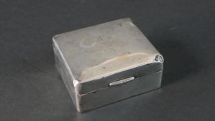 A weighted silver cedar lined square cigarette box. Hallmarked: WN Ltd for William Neale,