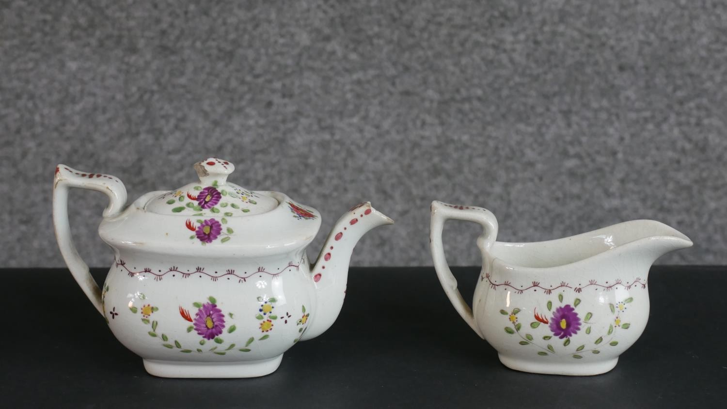 A 19th century floral design hand-painted ceramic dolls tea set for four people (one cup missing), - Image 2 of 8
