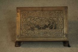 A 19th century pierced design cast iron book stand, the centre with makers mark monogram CG&Co. H.24